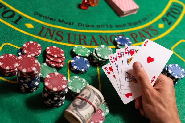 man playing blackjack at the table.