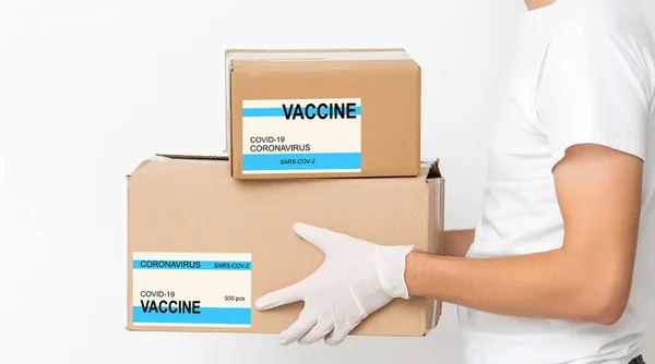 Vaccinated covid-19 printed on cardboard box. Virus epidemic, vaccine against COVID-19, medicine, health and disease resistance concept