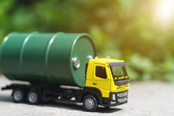 Metal model of truck with barrels for fuel.