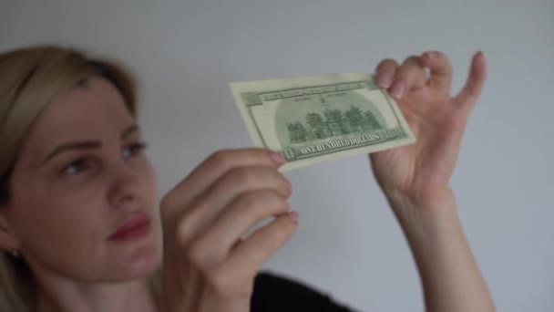 Woman Holding Dollar Bill Looking Watermarks Closeup Counterfeiting Money Concept — Αρχείο Βίντεο