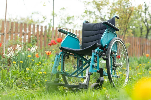 old wheelchair in the garden