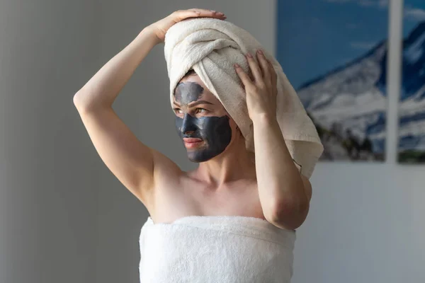 Beautiful Caucasian Woman Towel Her Hair Applies Face Mask Taking — Stockfoto