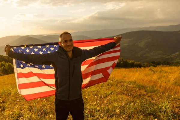 Man Holding American Flag — 스톡 사진