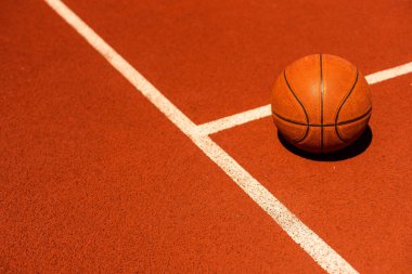 Basketball on Court Floor close up.