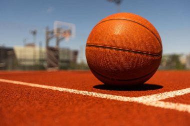 Basketball on Court Floor close up.