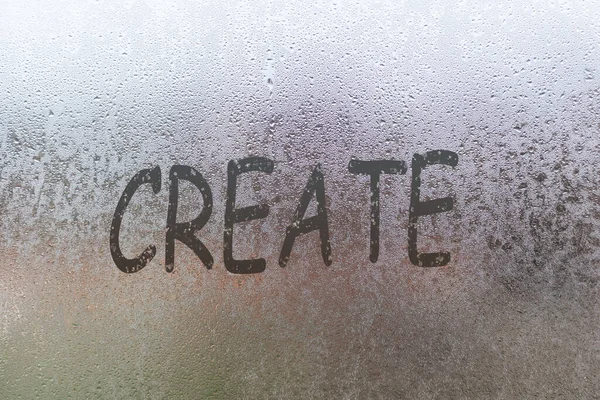 Handwritten lettering create on misted glass on window with raindrops, concept of full life and motivation.