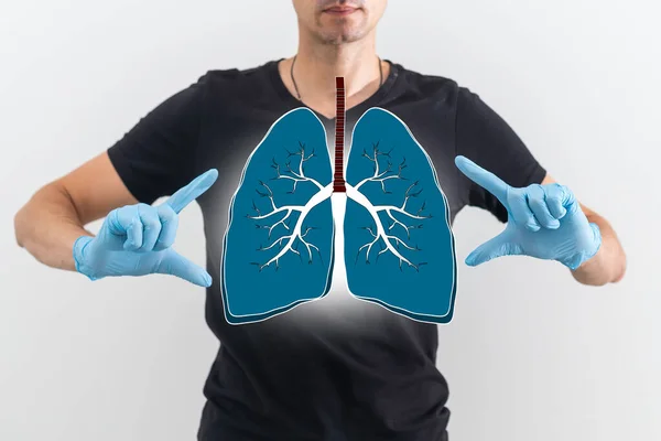 The doctor looks at the hologram of Lungs, checks the test result on the virtual interface and analyzes the data. Pneumonia, donation, innovative technologies, medicine of the future