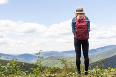 Fit woman walking on the mountain. Healthy lifestyle concept.