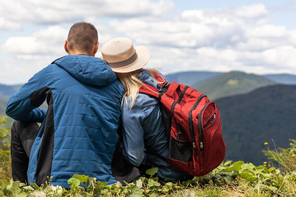 beautiful young couple enjoying nature at mountain.