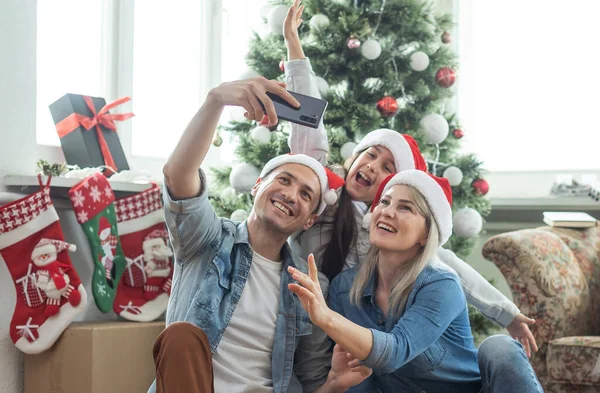 Family Having Fun Playing Together Christmas Tree Indoors — Foto Stock