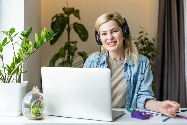 Photo of young woman confident consultant coworking agent headphone speaker.