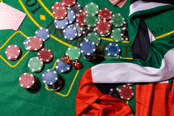 poker chips, emirates flag on blackjack table.