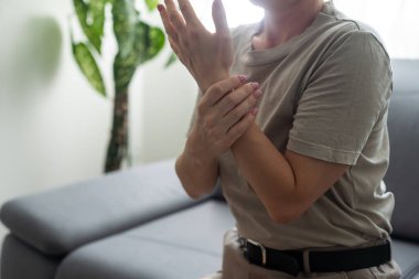 Hand Pain. Close-up of an office worker. Hands Hurt. Close-up Of Womans Hands With Painful Feeling In Joint. Hand Injury And Health Issues Concept.