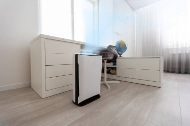 A modern humidifier in the childrens bedroom. Maintaining the climate in the apartment.