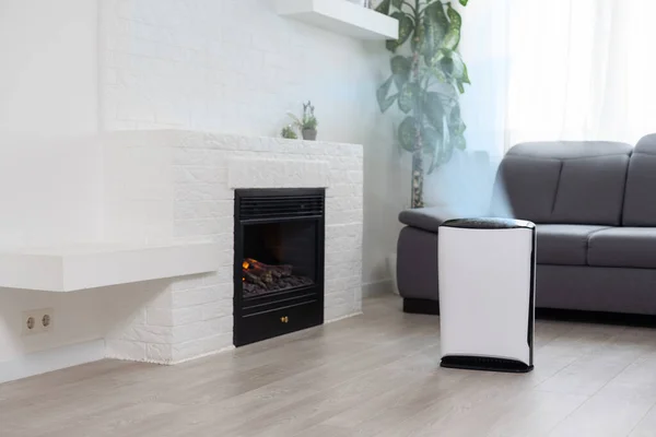 White Air purifier in living room for fresh air and healthy life. Copy space.