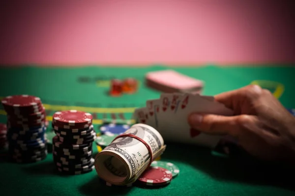 man playing blackjack at the table.