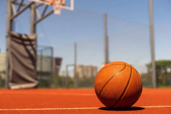 Basketball on Court Floor close up.