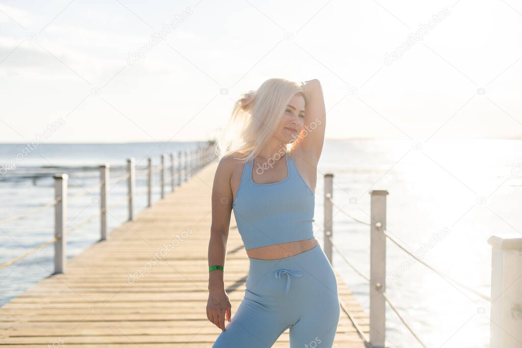 A sexy woman on floating pontoon towards a posh resort. Lifestyle and recreation