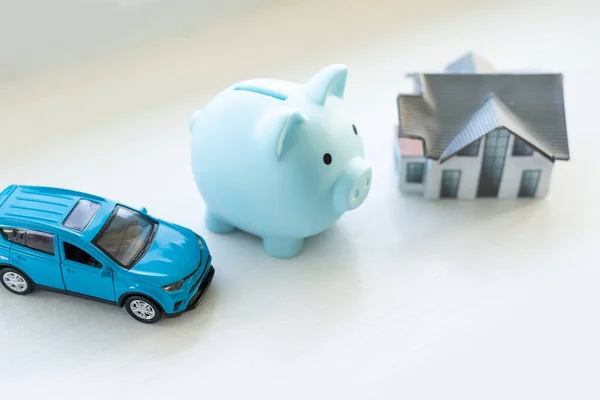 Piggy bank financial savings for house and car. Buying and renting real estate and transport concept