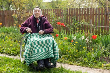 very old senior woman in wheelchair.