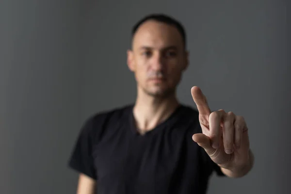 man points his finger at you