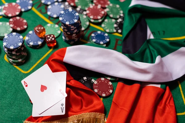 poker chips, emirates flag on blackjack table.