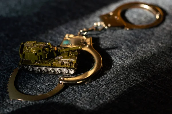 Toy Tank Handcuffs Dark Background — стоковое фото