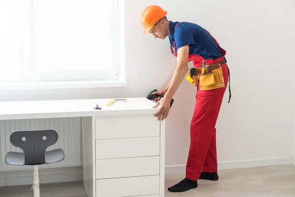 Handyman Assembling Wooden Furniture Childrens Room — Fotografia de Stock