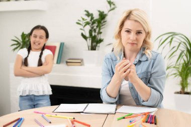 daughter taunts her mother at home