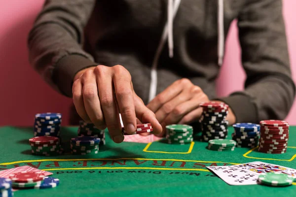 man playing blackjack at the table.