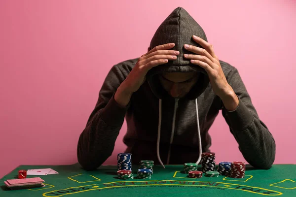 man playing blackjack at the table.