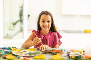 Childrens picture made from autumn leaves paint. High quality photo