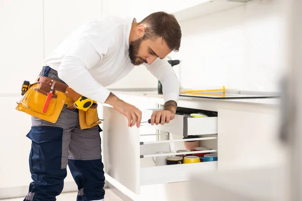 Repairman Overalls Repairing Cabinet Hinge Kitchen — Stock Photo, Image