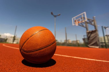 Basketball on Court Floor close up.