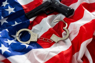 History. handcuffs and gun USA flag.