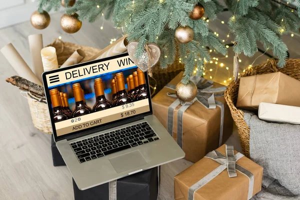Buying wines online, home delivery concepts. screen laptop computer on table with wine bottle.