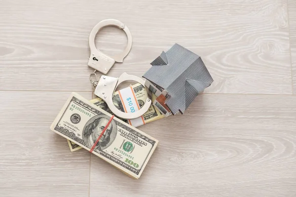 Small Toy House Handcuffs Lies Money — Stock Photo, Image