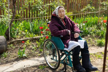 very old woman in a wheelchair.