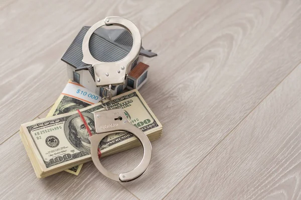 Small Toy House Handcuffs Lies Money — Stock Photo, Image