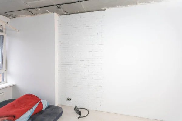 Interior renovation of a residential apartment using drywall without painting. Construction work indoors, renovation process inside the house.