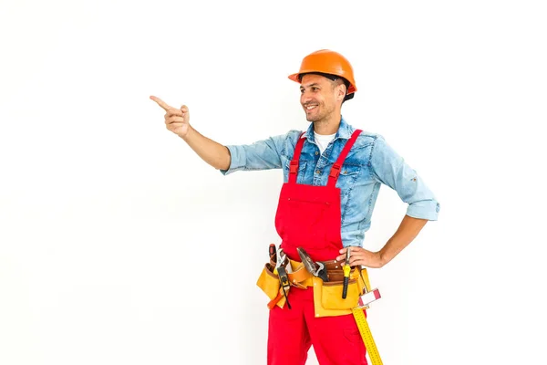Ernsthafter Bauarbeiter Mit Gelbem Helm Und Orangefarbenem Blick Studioaufnahme Voller — Stockfoto