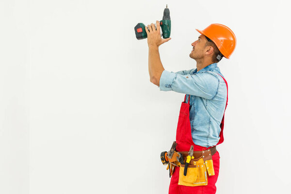 Young construction workers with hard hats on a white background.