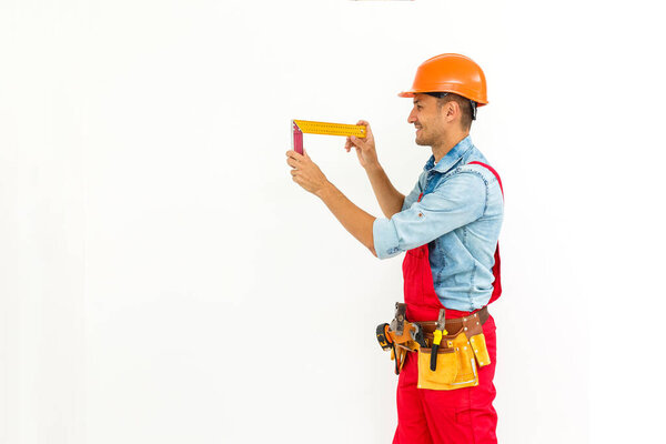 Construction worker pulling a rope. Full length studio shot isolated on white.