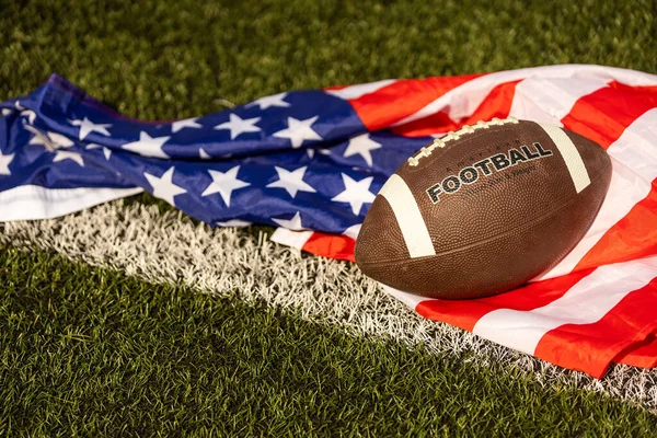 american football ball and flag.