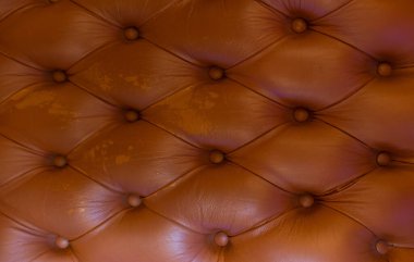 Arka plan olarak antika kırmızı bir kanepenin parçası..