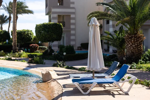 Hotel swimming pool, peaceful, relaxing and surrounded by nature. Clean swimming pool and sunbeds for tourists on holiday