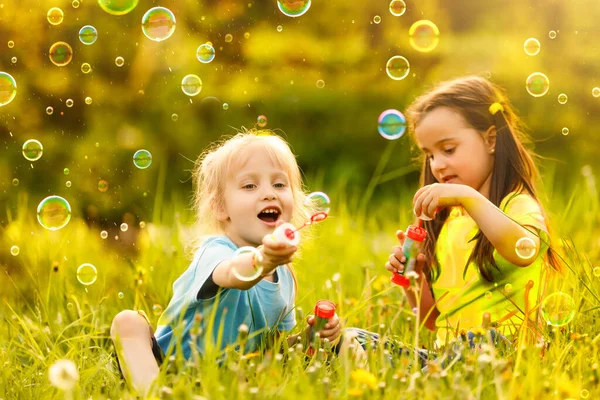 Two Cheerful Cute Girls Playing Outdoors Huge Soap Bubbles — Stock Photo, Image