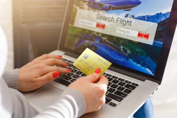 Flights online booking and reservation. woman working with a computer, search flights on the screen, office business background.
