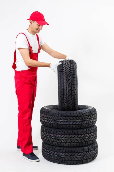 Working Man Full Growth Holds Tire White Background — стоковое фото