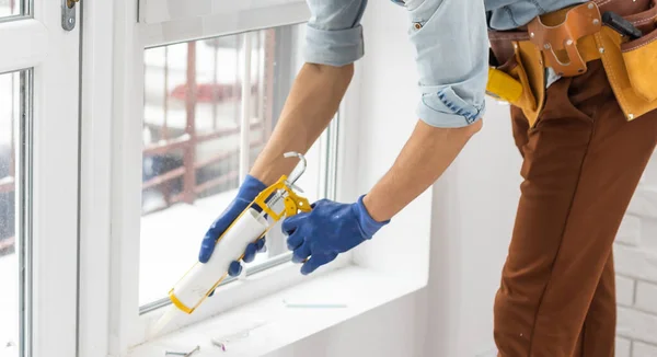 Construction Worker Sealing Window Caulk Indoors — Stock Photo, Image